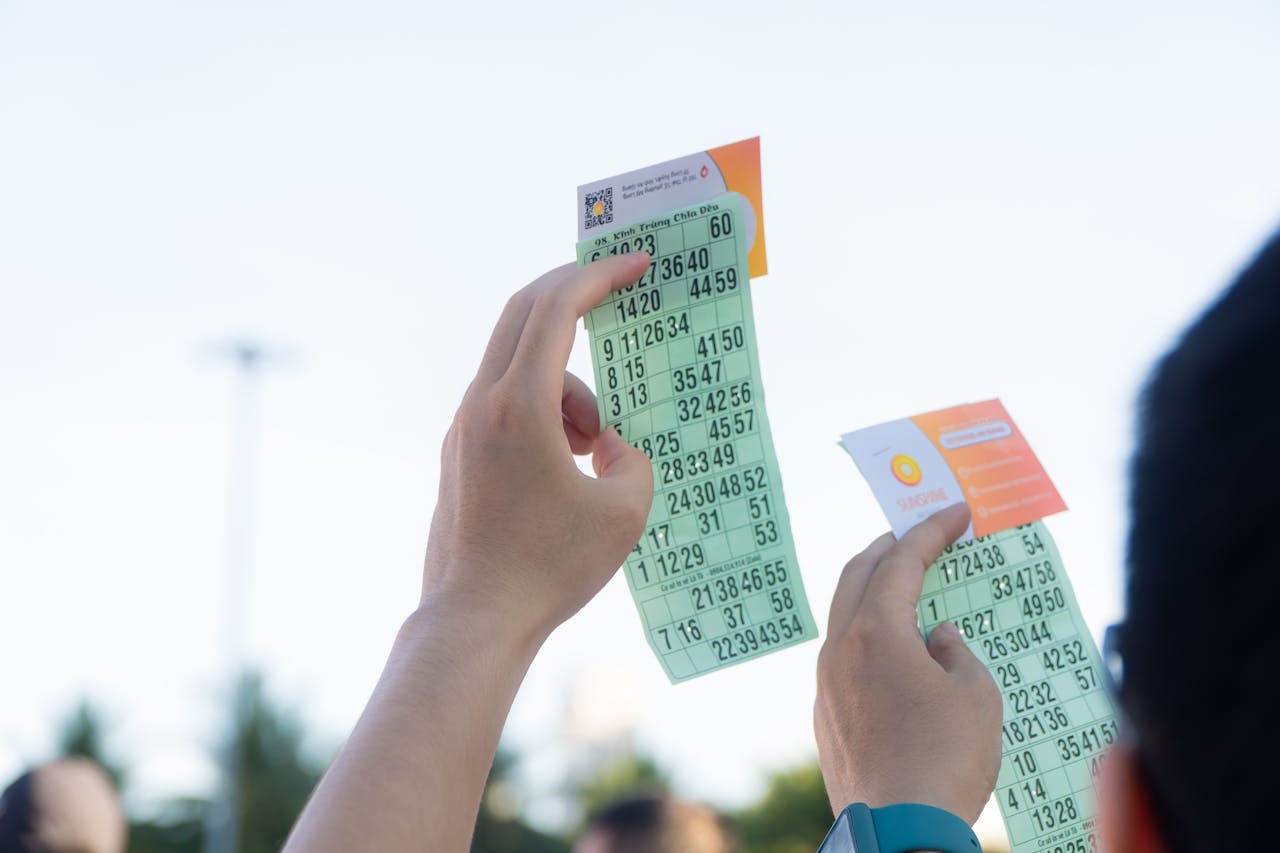 why-choose-us Close-up of hands holding transportation tickets, showcasing numbers and fare details.